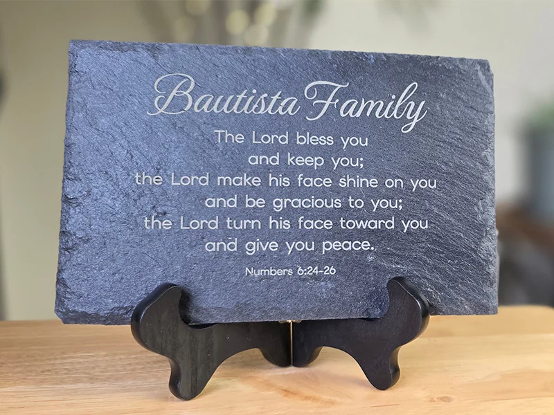 Personalized stone slate with the Bautista family name and a Scripture blessing